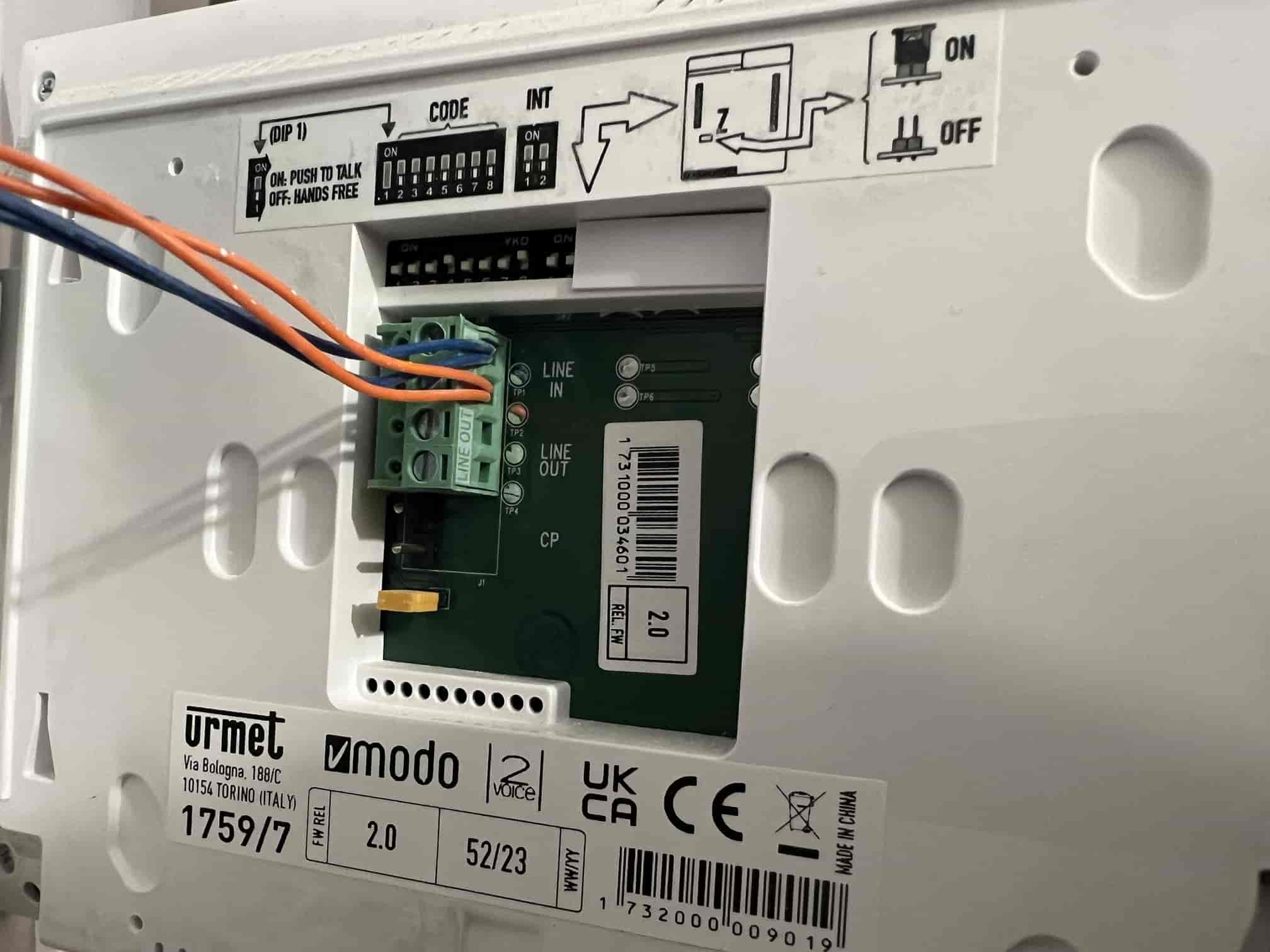 Wiring connected inside the home intercom for the lobby door release automation
